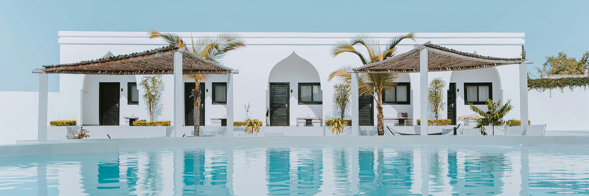 Luxury villa in Tanzania with a pool facing the savannah, where sunsets fall into gold across the horizon.