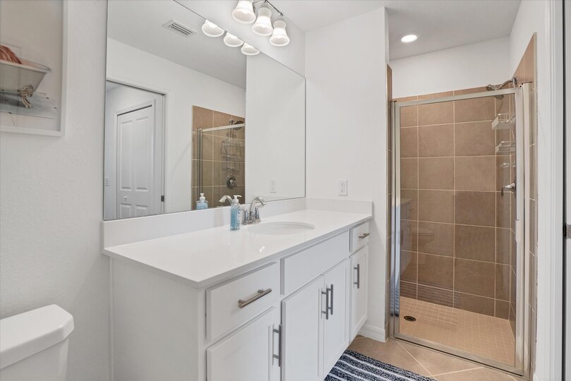 Primary attached bathroom with walk-in shower