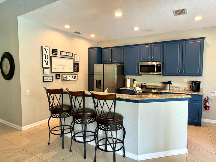 Enjoy a quick snack at the breakfast bar with seating for 3