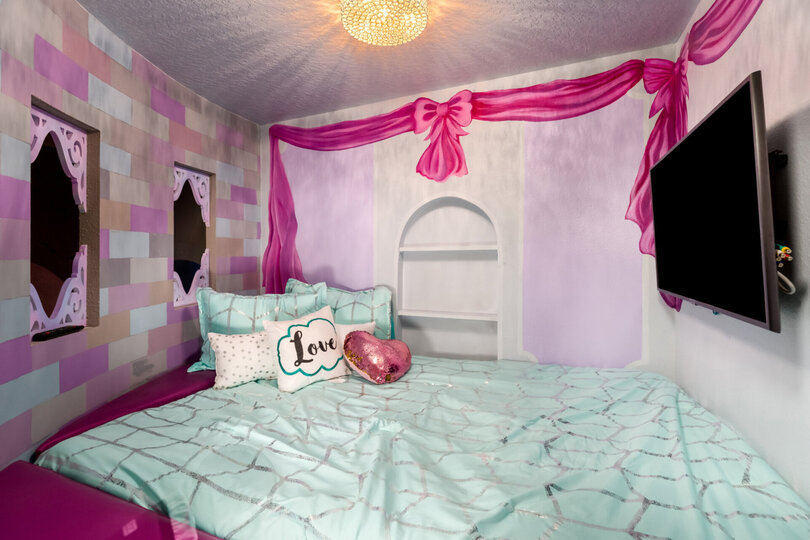 This bedroom features a SMART TV so the princesses can watch all their favorite movies and tv shows