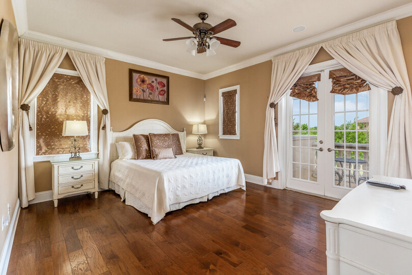 The lavish master suite features a comfortable king bed
