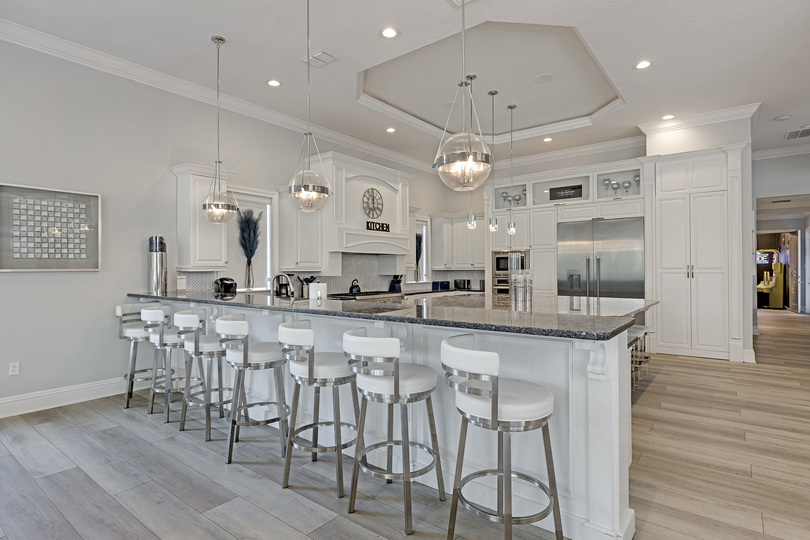 Additional bar and island seating for 7 around the kitchen