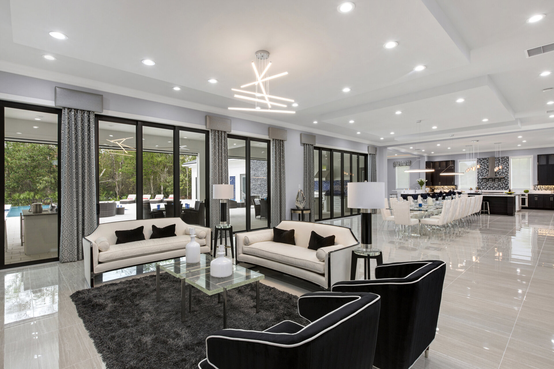 This modern themed living area features a fantastic open concept floorplan perfect for the larger group vacations
