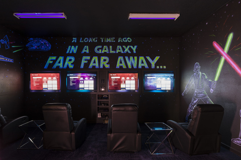 Everyone can enjoy their own movie or game on each TV in this amazing games room