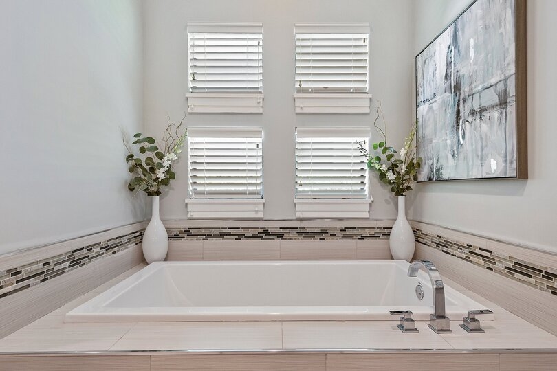 Features a large tub and walk in shower