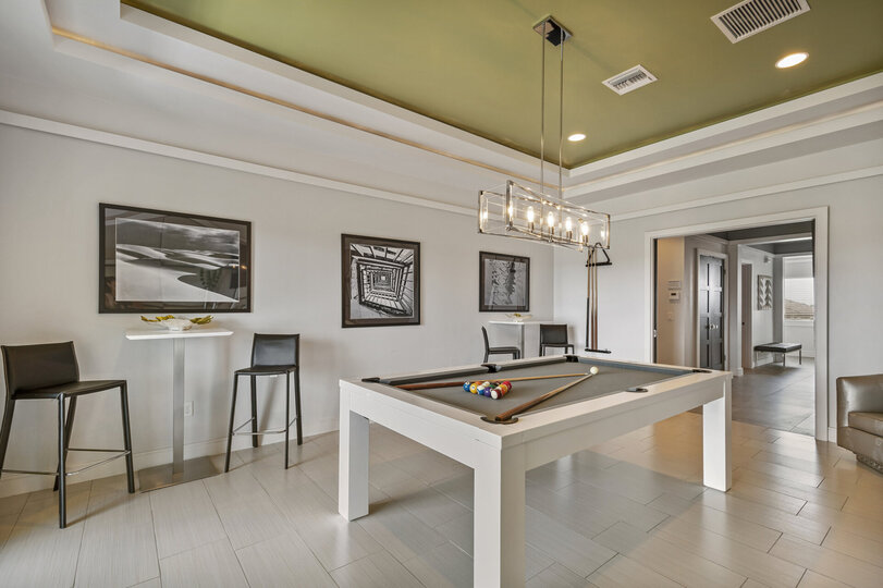 The 3rd floor loft games area features a pool table and plenty of seating