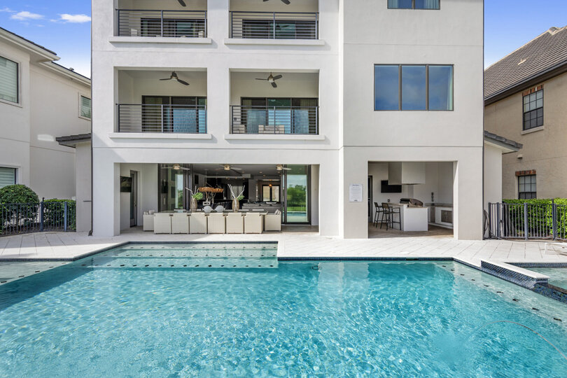 A perfect crystal blue pool awaits you on your vacation at the Modern Estates