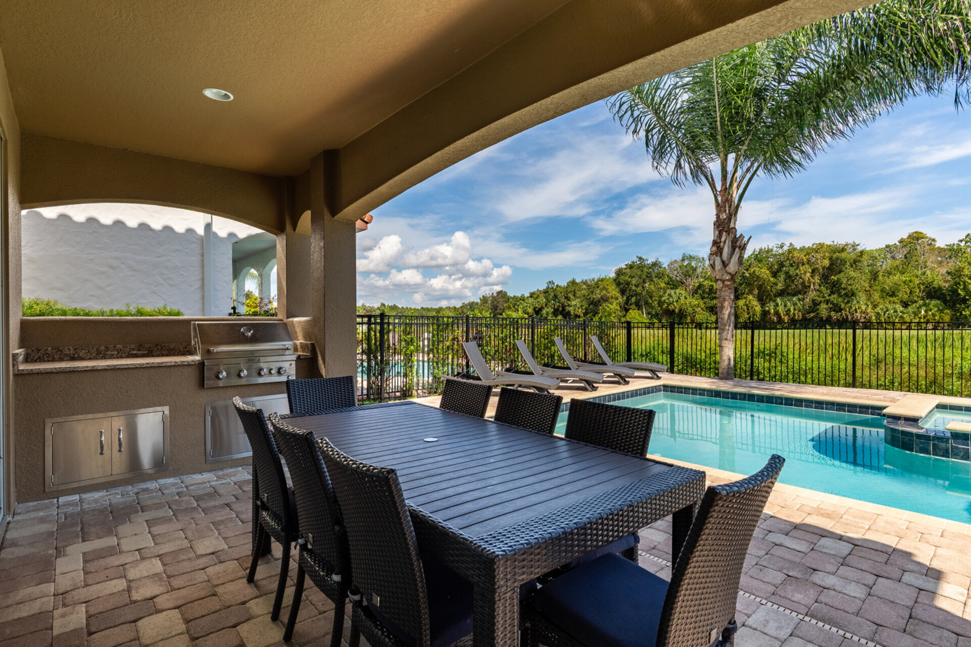 Dine al fresco with seating up to 8 guests and grill up lunch for the family in the summer kitchen.