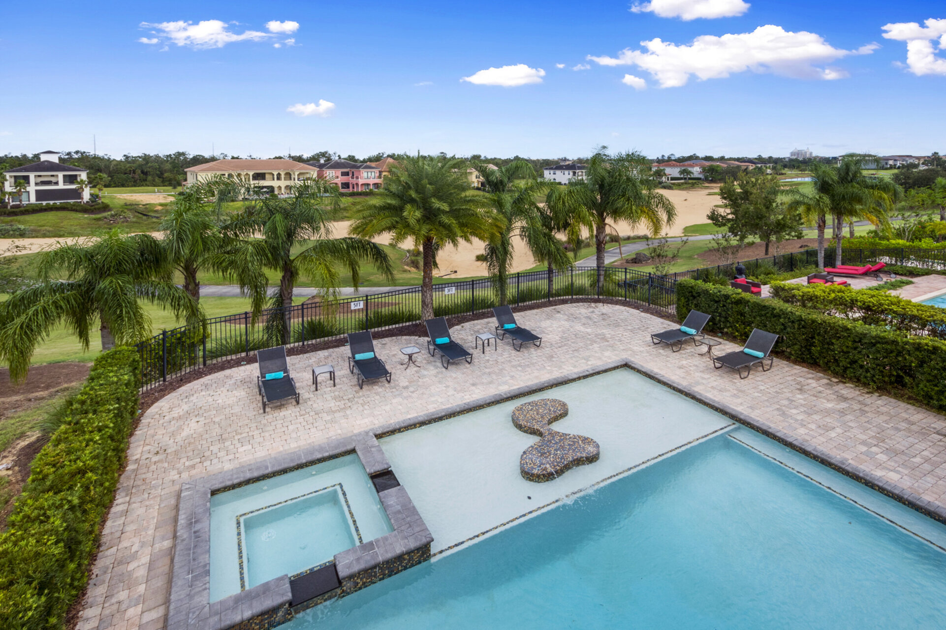 Walk outside to the balcony and take in the beautiful views of the pool and of the golf course