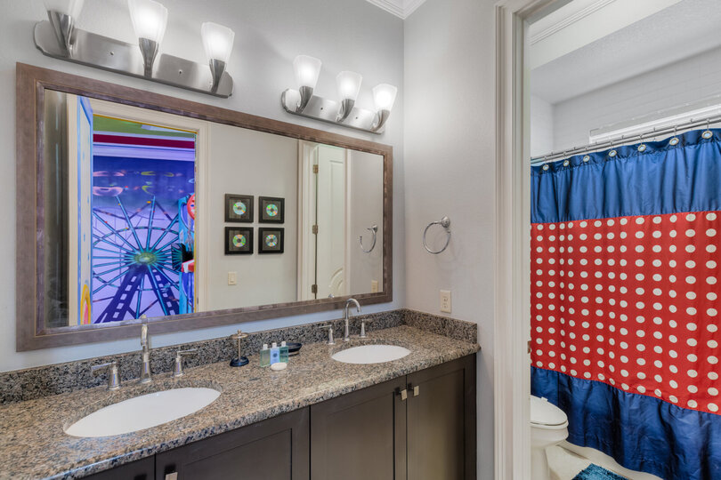 Private bathroom with a shower tub combo