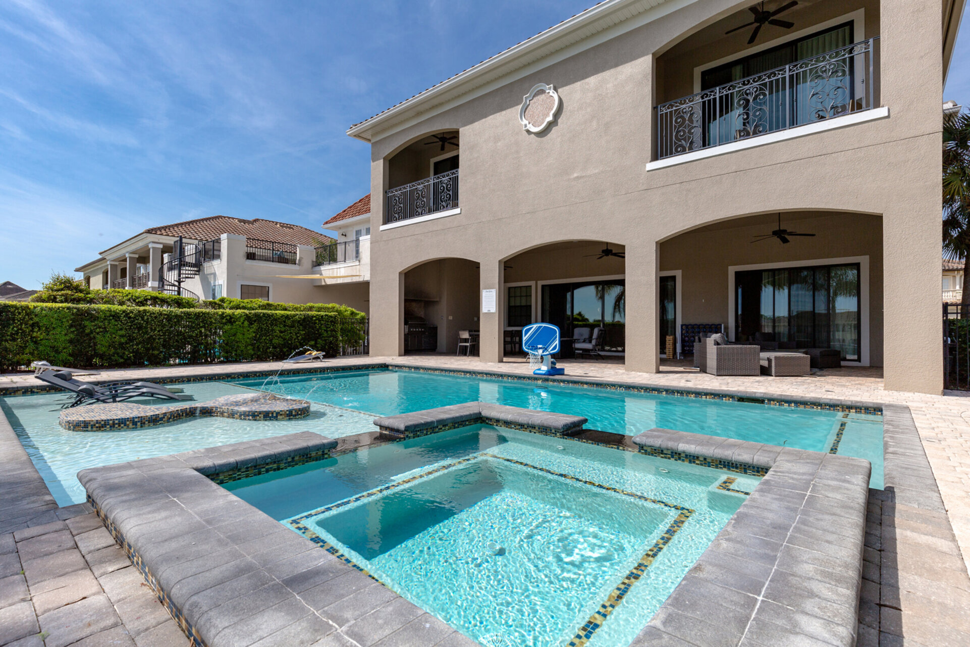 Lounge in the private pool with spillover spa