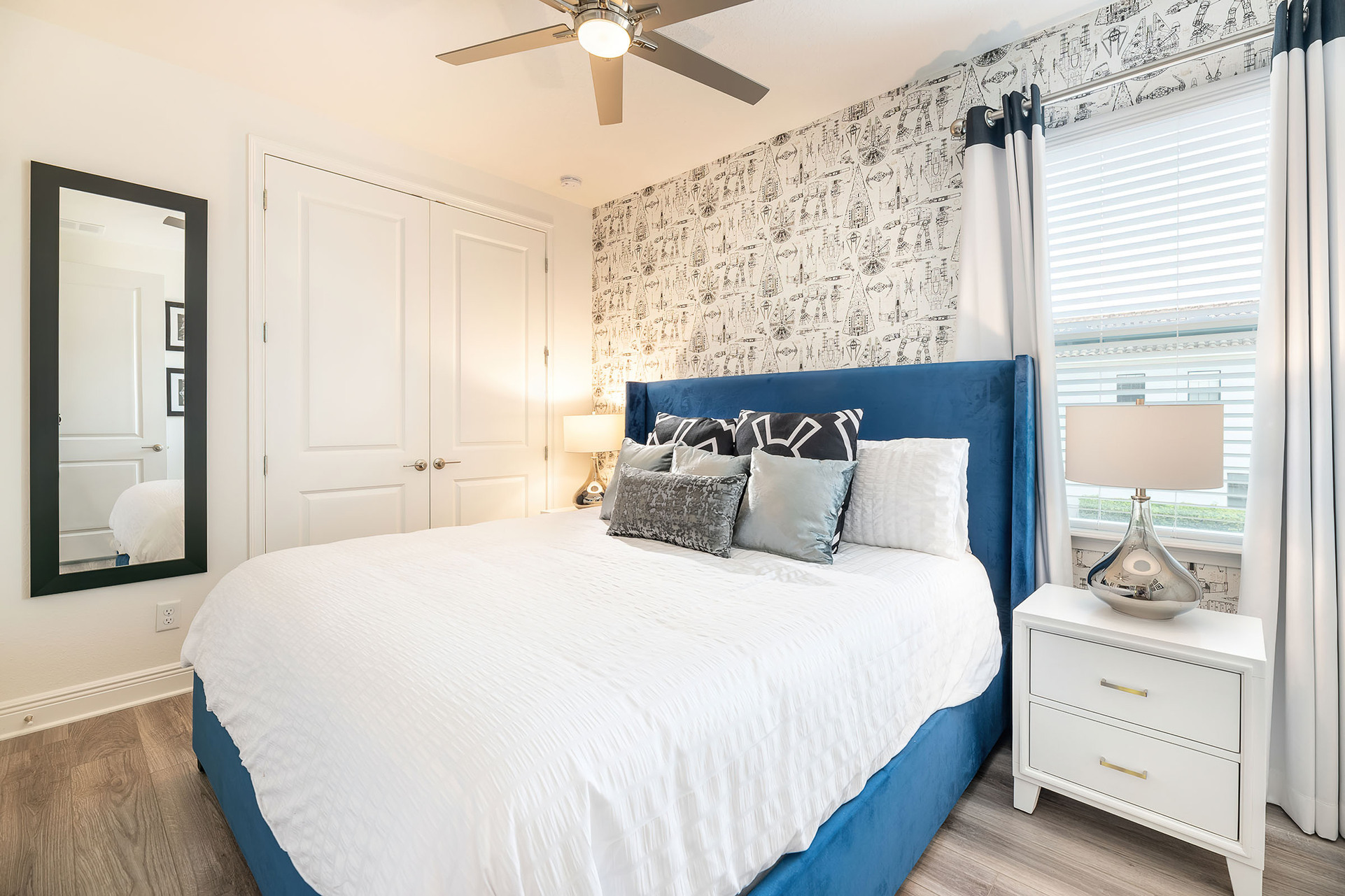 This bedroom features a comfortable king-sized bed