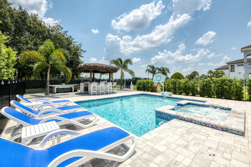 Soak up the sun in one of the poolside loungers