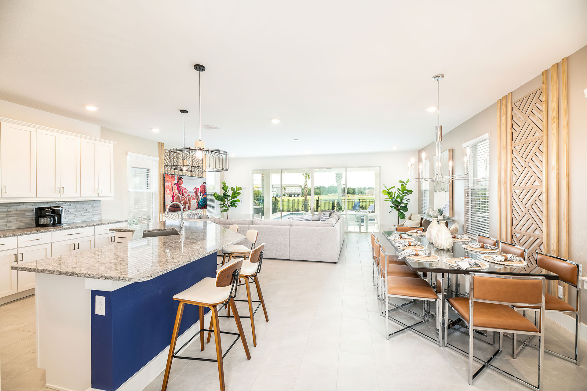 Step inside to the large open concept living area with modern, coastal-style furnishings