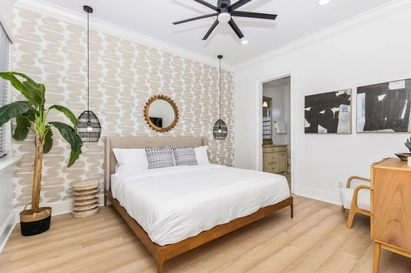 Retreat to the serene master bedroom, a spacious haven complete with luxurious furnishings and a tranquil ambiance