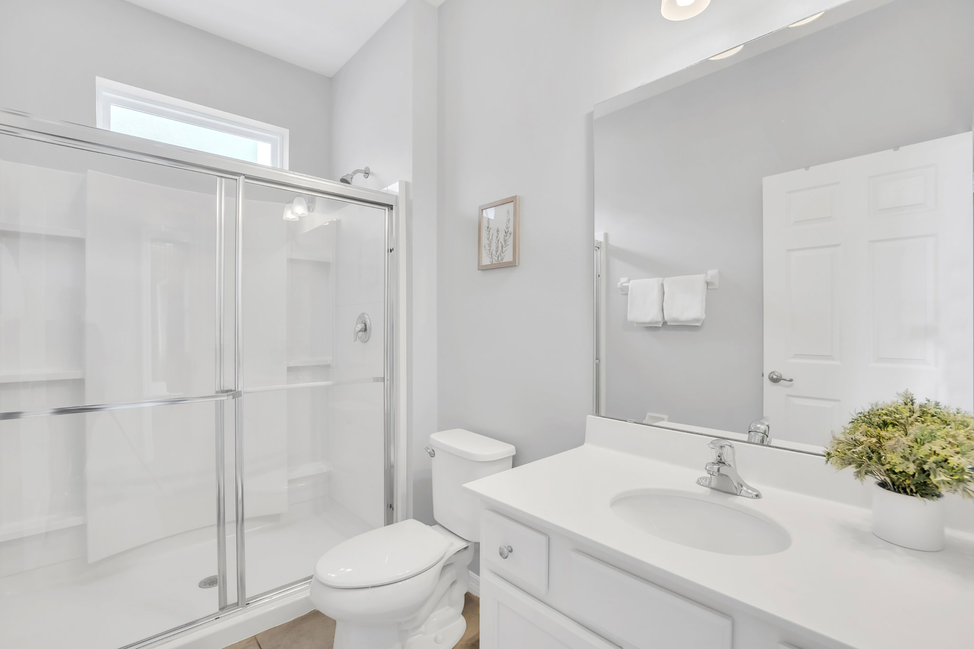 Family bathroom on the first floor with walk in shower. This bathroom also connects to the pool deck.