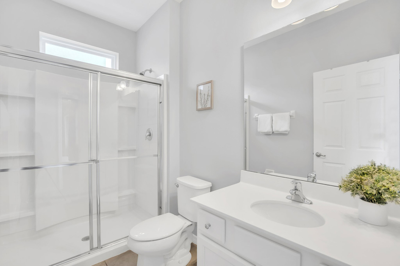 Family bathroom on the first floor with walk in shower. This bathroom also connects to the pool deck.