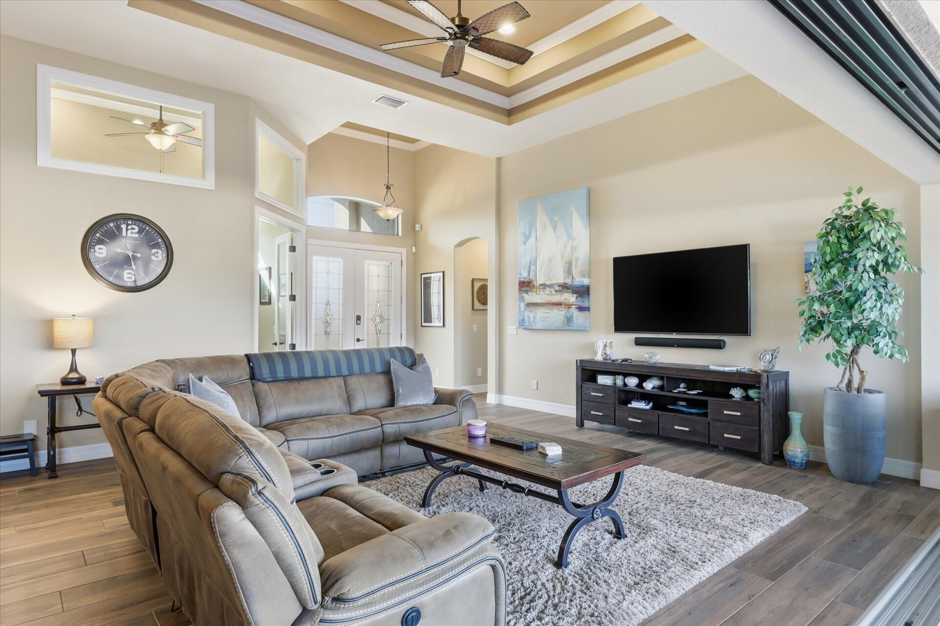 Living room with comfy seating and 70-inch Smart TV