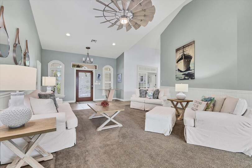 Living room overlooking the sparkling pool