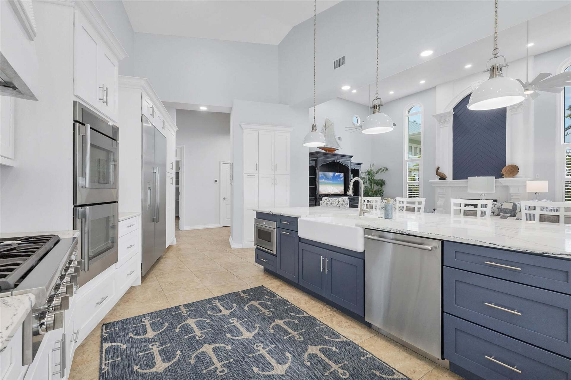 Gorgeous, fully-equipped kitchen features high-end stainless-steel appliances, and plenty of storage and counter top space